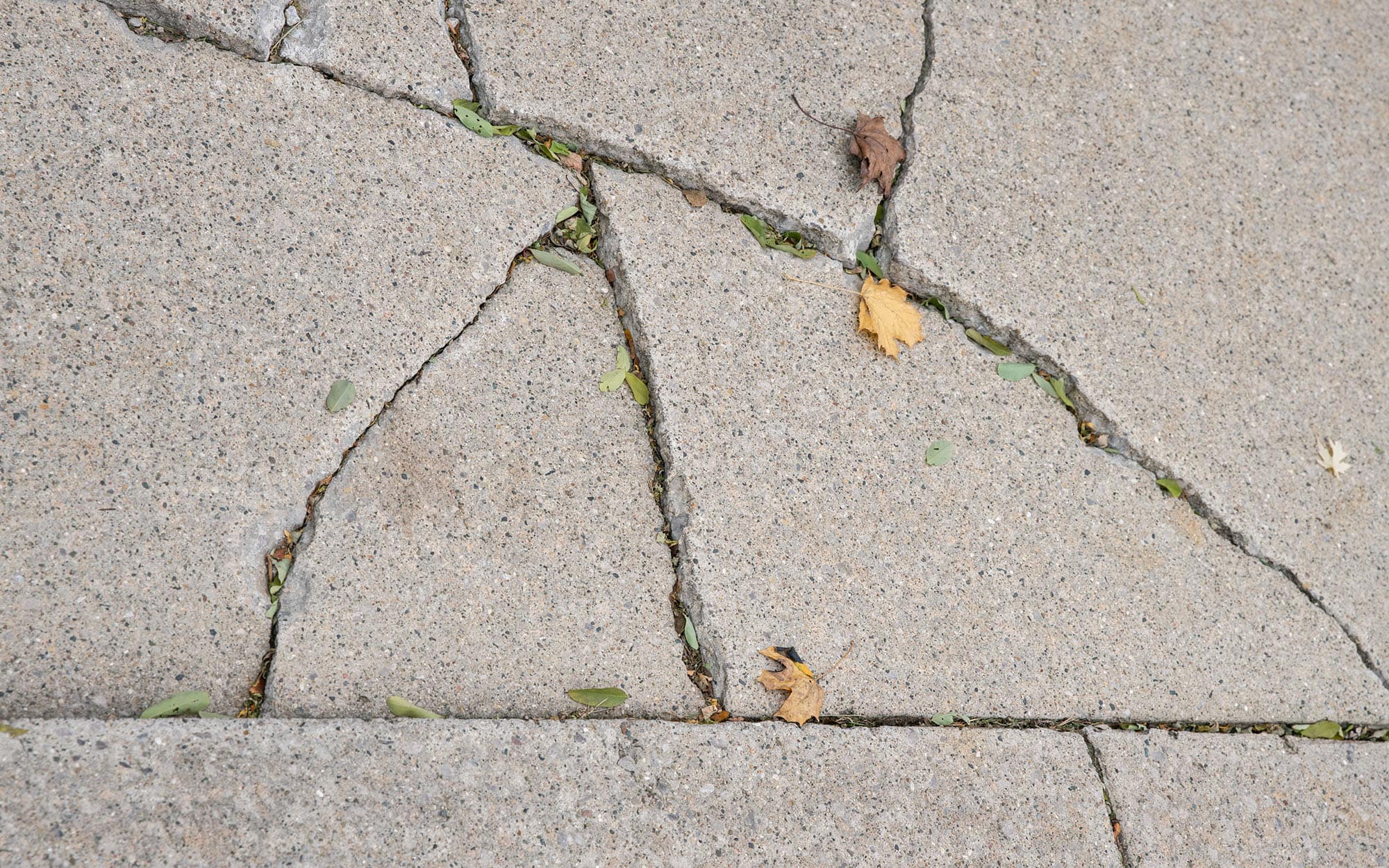 Top-down view, concrete is broken and needs repair