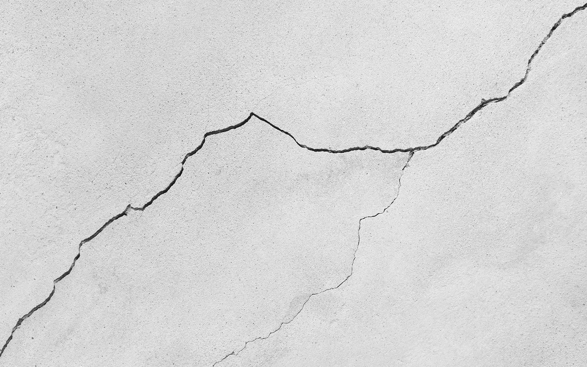 Cracked pattern on the cement wall as background