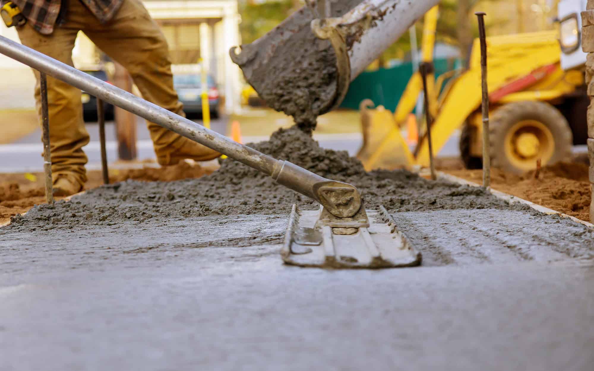 Worker working for concrete pavement for ground construction