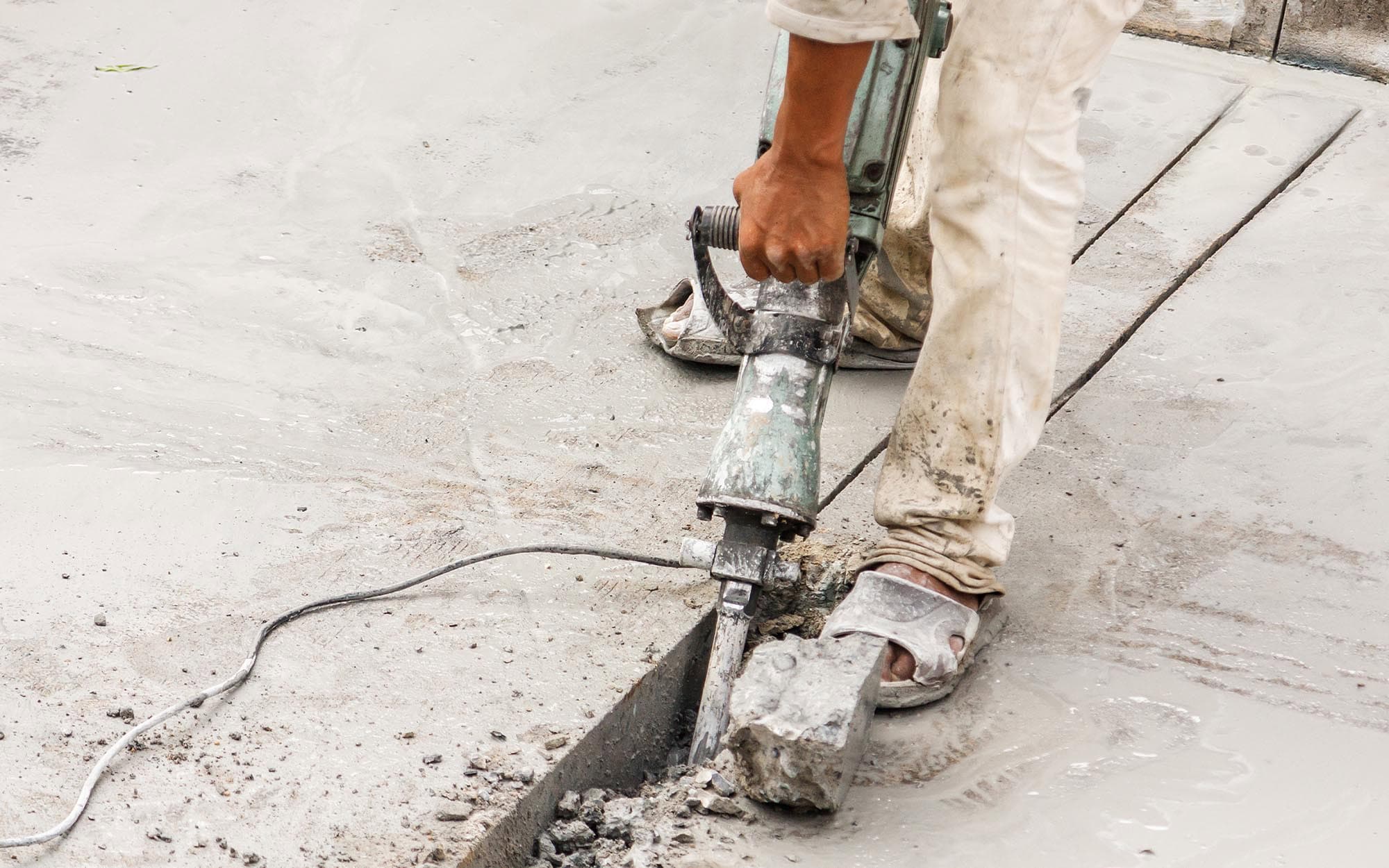 Worker pouring concrete
